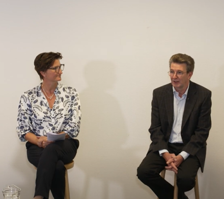 Picture displaying the panel discussion between four people.